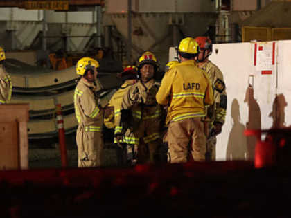Los Angeles Fire Department (LAFD) firefighters are seen at the site of an industrial tunn
