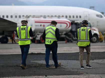 US Immigration and Customs Enforcement (ICE) agents prepare for the arrival of Guatemalan